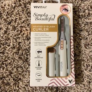 Heated eye lash curler